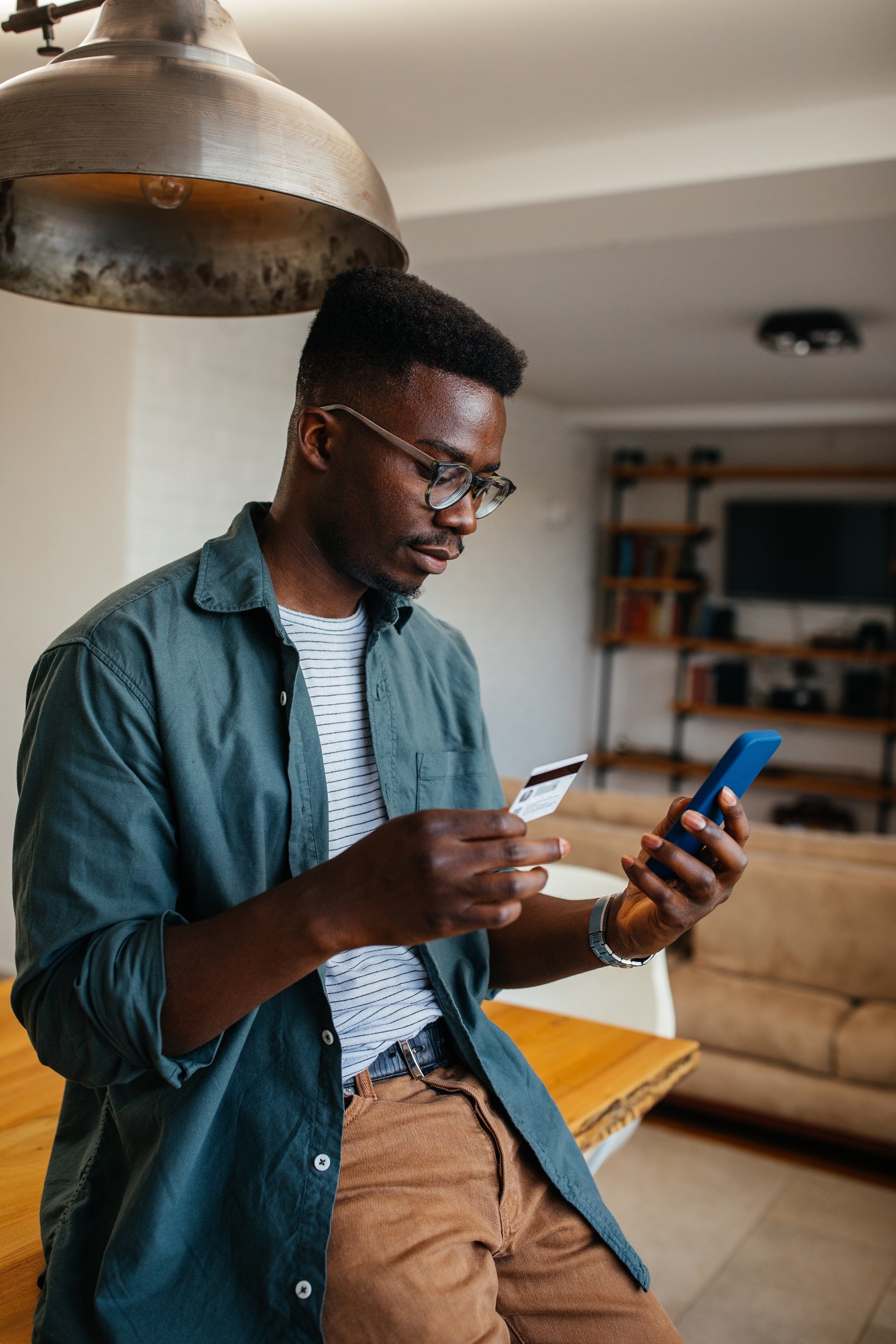 Man looking up Ford Financing options on his phone